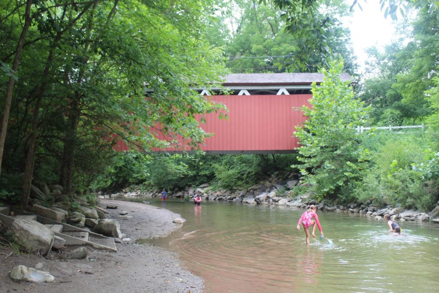 Children play underneath the covered bridge in Peninsula, Ohio. 