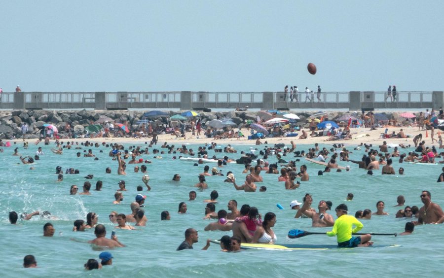 People enjoy a warm day at the beach in Miami Beach, Florida, USA, 12 July 2020. Florida reports 15,300 new Coronavirus cases, a record for one day anywhere in the US. Coronavirus in Miami, USA - 12 Jul 2020