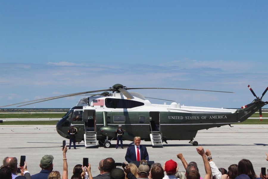 President Donald Trump addresses a crowd of supporters at Burke Lakefront Airport in Cleveland.