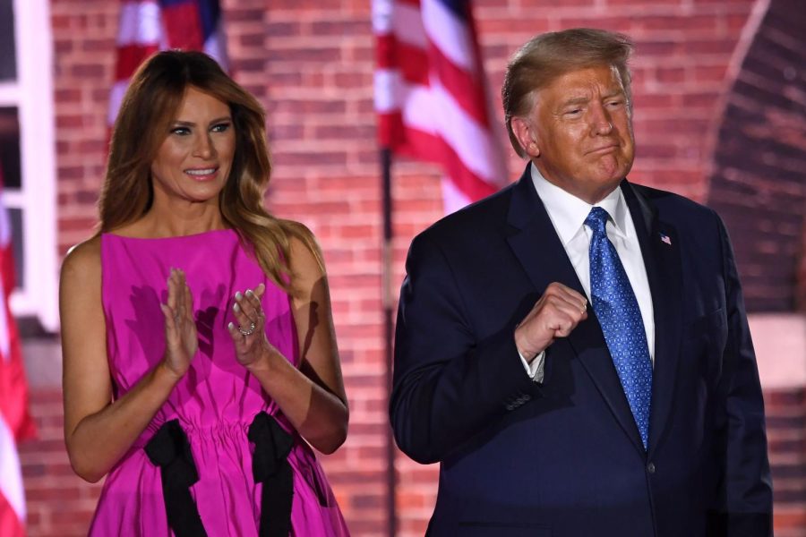 First Lady Melania Trump and President Donald Trump gesture to attendees during the third night of the Republican National Convention at Fort McHenry National Monument in Baltimore, Maryland, August 26, 2020.