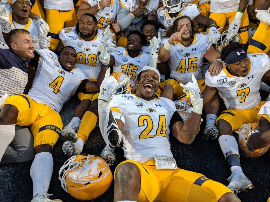 Kent State’s football team celebrates after defeating Akron last season. Oct. 12, 2019.