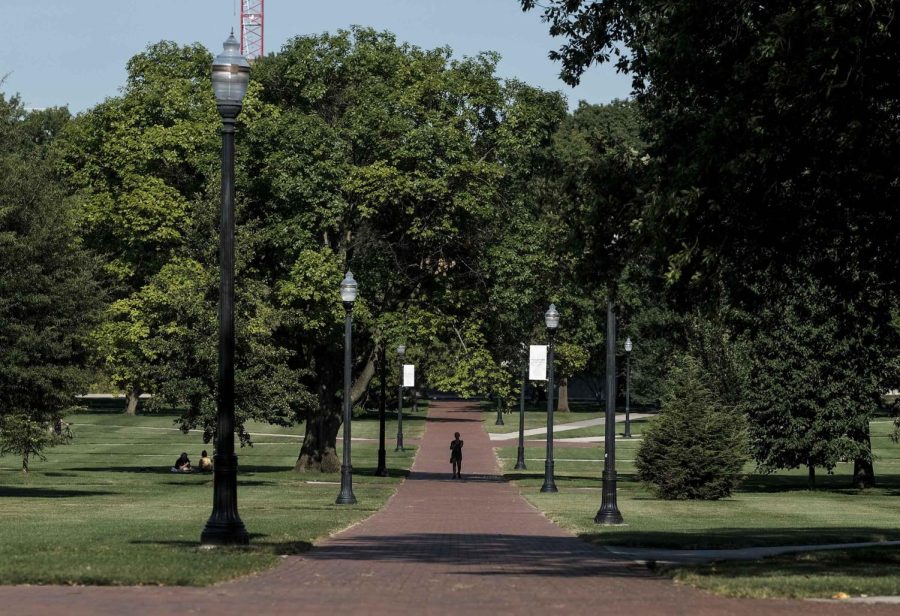 A lone person makes their way through the 'Oval' at Ohio State University, a part of campus which, during the school year, is popular with students and faculty of the university, on August 13, 2020 in Columbus, Ohio.