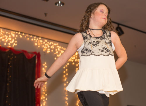 Genevieve struts down the runway during the Dress Up for Downs fashion show in the Rockwell Hall on Saturday, November 18, 2017.