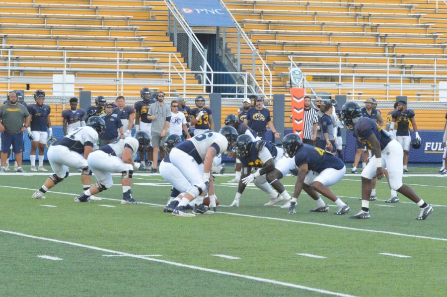 Defense and offensive lines getting set up before the start of a play at the fall scrimmage before the start of the season on Aug. 19 2019.