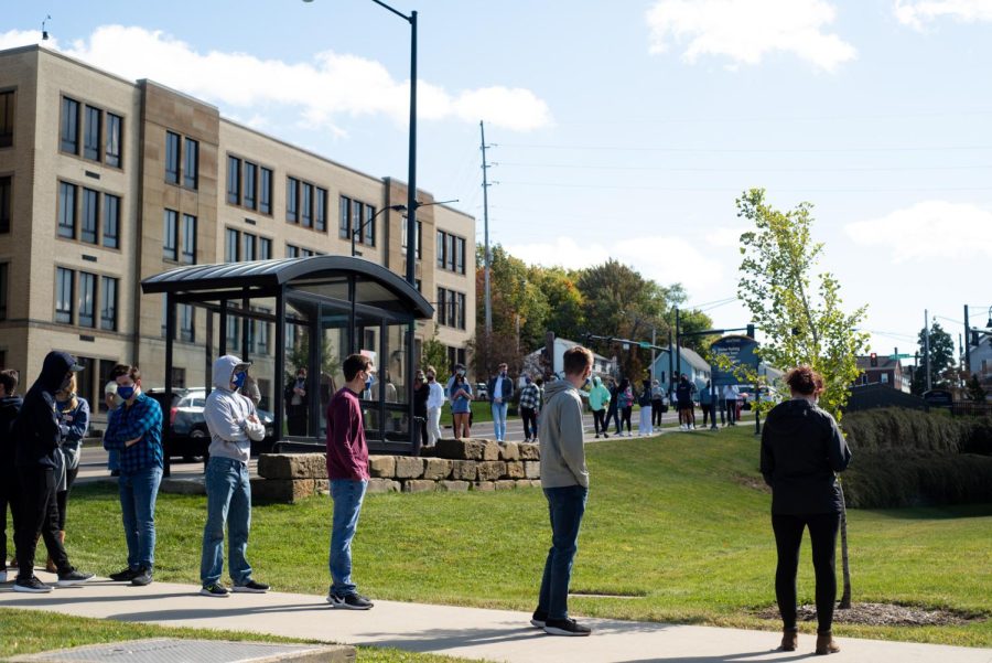 Students wait in line for COVID-19 testing Friday at the Center for Philanthropy and Alumni Engagement. After increased cases of COVID-19 at Kent State University, mass testing was brought to campus.