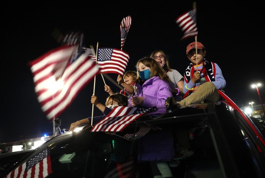 Supporters of President-elect Joe Biden wait outside the Chase Center for Biden to address the nation November 07, 2020 in Wilmington, Delaware. After four days of counting the high volume of mail-in ballots in key battleground states due to the coronavirus pandemic, the race was called for Biden after a contentious election battle against incumbent Republican President Donald Trump.