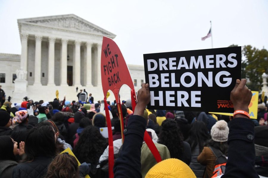 Immigration rights activists take part in a rally in front of the US Supreme Court in Washington, DC on November 12, 2019. - The US Supreme Court hears arguments on November 12, 2019 on the fate of the "Dreamers," an estimated 700,000 people brought to the country illegally as children but allowed to stay and work under a program created by former president Barack Obama.Known as Deferred Action for Childhood Arrivals or DACA, the program came under attack from President Donald Trump who wants it terminated, and expired last year after the Congress failed to come up with a replacement. (Photo by SAUL LOEB/AFP via Getty Images)