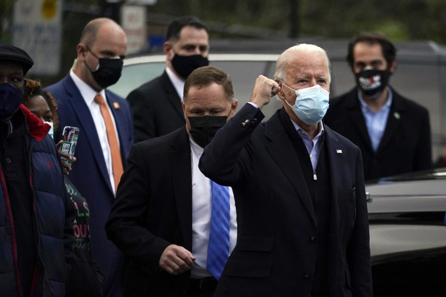 Democratic presidential candidate former Vice President Joe Biden visits with residents across the street from the Joseph R. Biden Jr. Aquatic Center in Wilmington, Del., Tuesday, Nov. 3, 2020. (AP Photo/Carolyn Kaster)