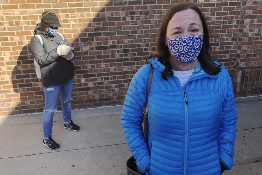 On Friday, Oct. 30, 2020, Stacy Carlson of Hilliard in suburban Columbus, Ohio, said in no uncertain terms that the only issue important to her is voting out President Donald Trump. "The division of the country, his handling of COVID, his handling of civil liberties. The list goes on," said Carlson while waiting in a line of hundreds of early voters. (AP Photo/Andrew Welsh-Huggins)