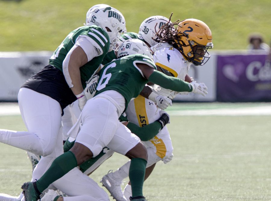 Senior running back Will Matthews is tackled during Kent State's game at Ohio University on Saturday, Oct. 19, 2019.