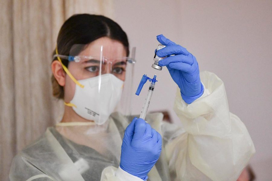 Jan 7, 2021; Mission Hill, CA, USA; Ararat House registered nurse Arpa Davoudian prepares to administer a COVID-19 vaccine to a resident at the Ararat House Nursing Facility on Jan. 7, 2021.. Mandatory Credit: Harrison Hill-USA TODAY/Sipa USA