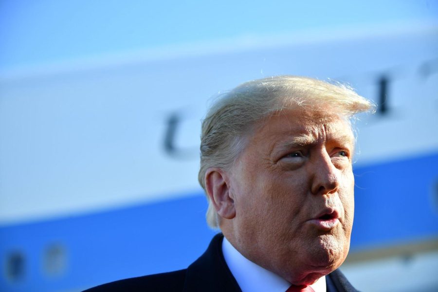 US President Donald Trump speaks to the media as he makes his way to board Air Force One before departing from Andrews Air Force Base in Maryland on January 12, 2021. - Trump is traveling to Texas to review his border wall project. (Photo by MANDEL NGAN / AFP) (Photo by MANDEL NGAN/AFP via Getty Images)