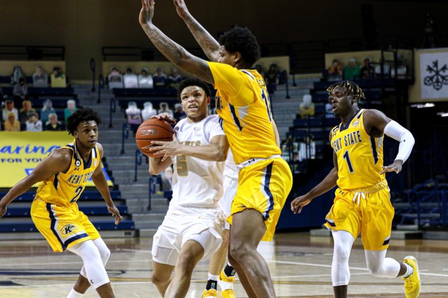 Senior Tervell Beck tries to stop a drive from Toledo's Ryan Rollins. Beck would score 16 as the Flashes fell 76-74. Jan. 23, 2021.