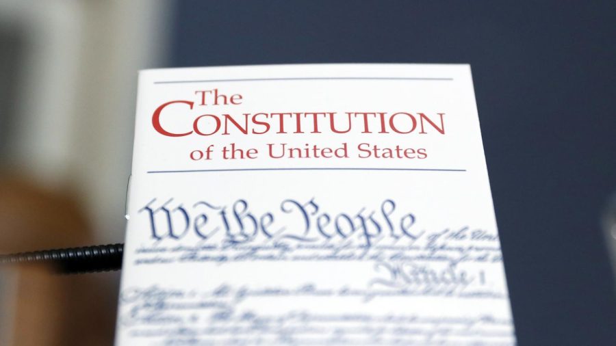 WASHINGTON, DC - DECEMBER 17: A copy of the U.S. Constitution is propped up in front of the desk of Rep. Alcee Hastings (D-FL) during a House Rules Committee hearing on the impeachment against President Donald Trump on December 17, 2019 in Washington, DC. (Photo by Andrew Harnik-Pool/Getty Images)