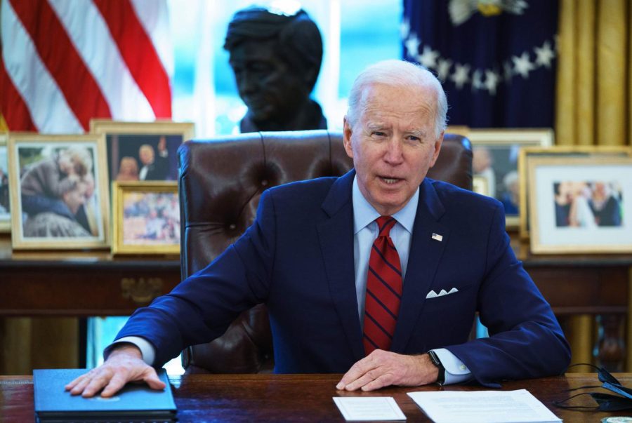 TOPSHOT - US President Joe Biden speaks before signing executive orders on health care, in the Oval Office of the White House in Washington, DC, on January 28, 2021. - The orders include reopening enrollment in the federal Affordable Care Act. (Photo by MANDEL NGAN / AFP) (Photo by MANDEL NGAN/AFP via Getty Images)