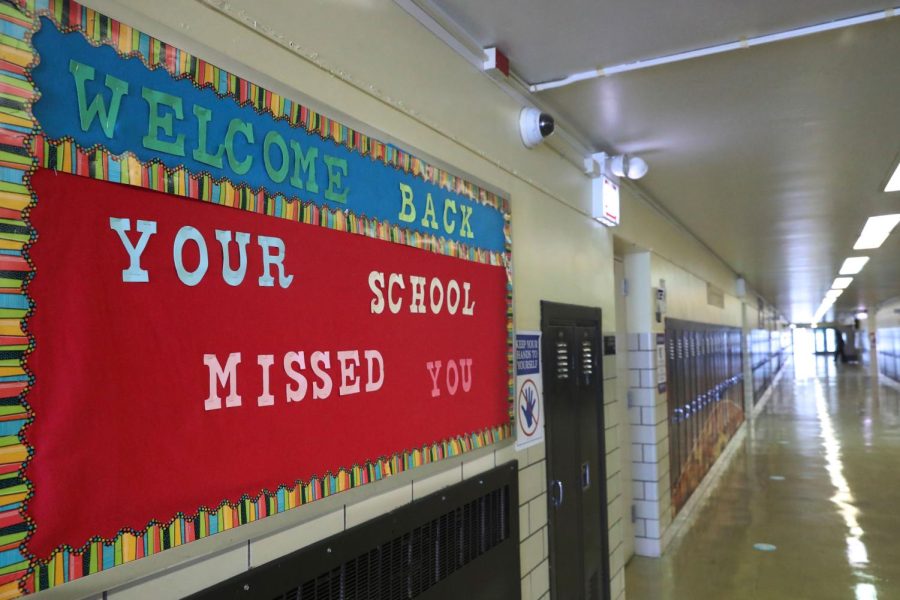 A Welcome Back sign on a bulletin board Thursday, Feb. 11, 2021, greets returning students at Chicago's William H. Brown Elementary School. In-person learning for students in pre-k and cluster programs began Thursday, since the district's agreement with the Chicago Teachers Union was reached. (AP Photo/Shafkat Anowar, Pool)