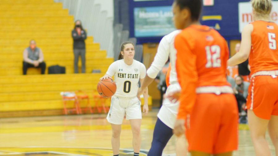 Freshman guard Casey Santoro (0) takes the ball up against Bowling Green. The game would go to overtime, but Kent State would lose 80-79. Feb. 10, 2021.