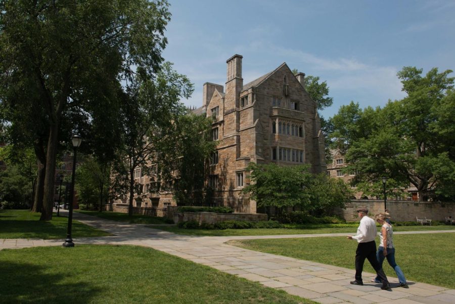 Pedestrians walk down a path on the Yale University campus in New Haven, Connecticut, U.S., on Friday, June 12, 2015. Yale University is an educational institute that offers undergraduate degree programs in art, law, engineering, medicine, and nursing as well as graduate level programs. Photographer: Craig Warga/Bloomberg via Getty Images