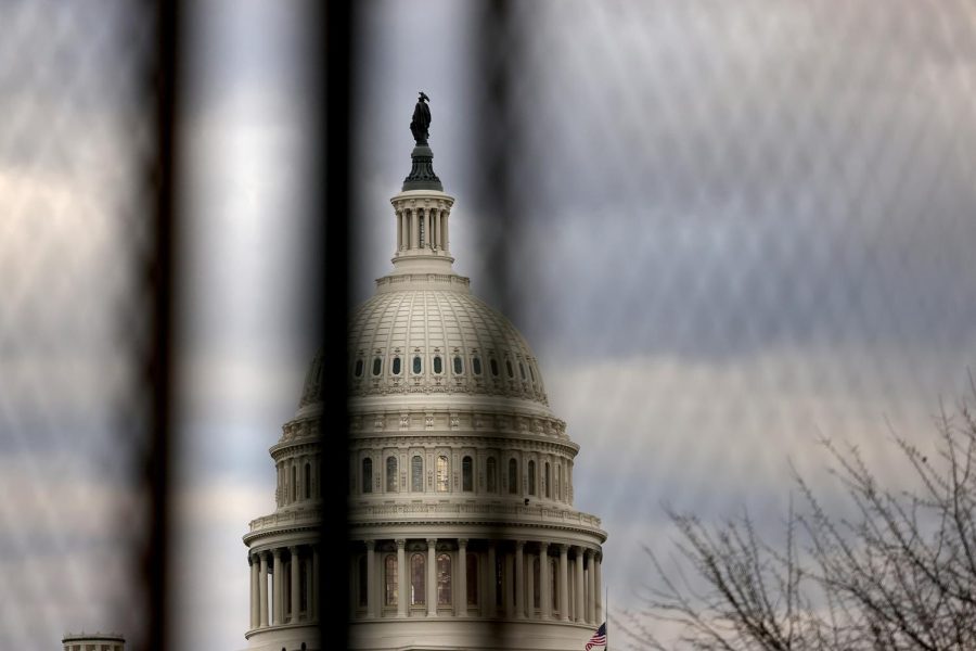 WASHINGTON, DC - JANUARY 17: The U.S. Capitol dome is seen beyond a security fence on January 17, 2021 in Washington, DC. After last week's riots at the U.S. Capitol Building, the FBI has warned of additional threats in the nation's capital and in all 50 states. According to reports, as many as 25,000 National Guard soldiers will be guarding the city as preparations are made for the inauguration of Joe Biden as the 46th U.S. President. (Photo by Michael M. Santiago/Getty Images)