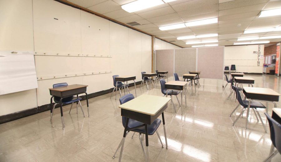 In Foust Elementary, classrooms are set up to accommodate physical distancing standards on Friday, Oct. 23, 2020 in Greensboro, N.C. Between classrooms, are movable walls and dividers since the school was originally integrated with students from multiple grades in one class. [Abby Gibbs/The News &amp; Record].