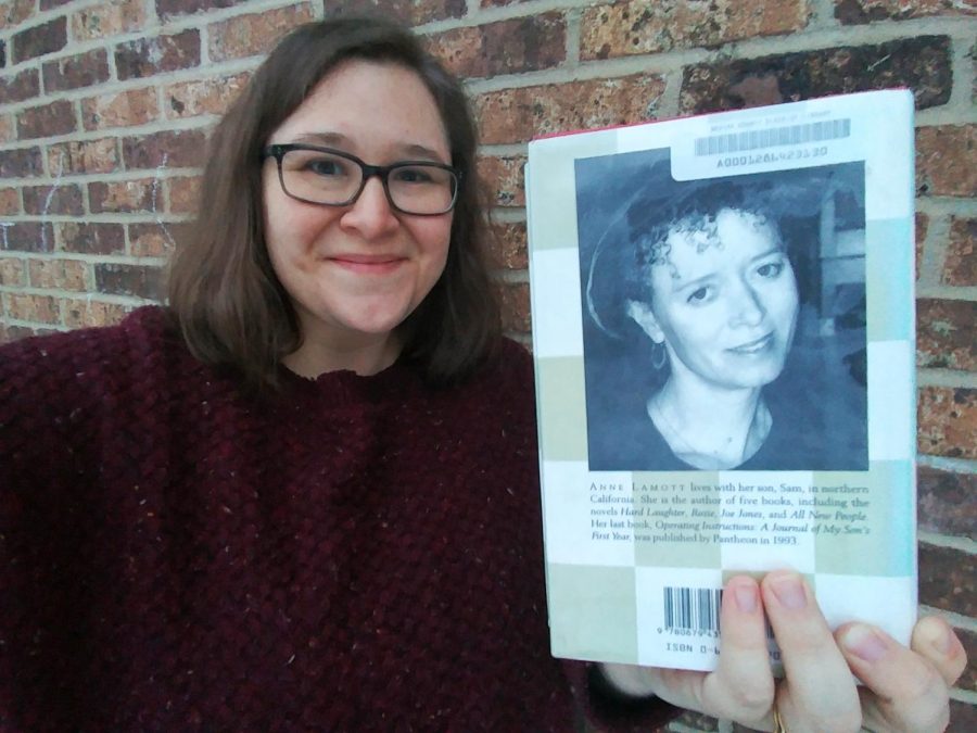 Brennan poses with Anne Lamott's author photo on the back of a copy of Bird by Bird.