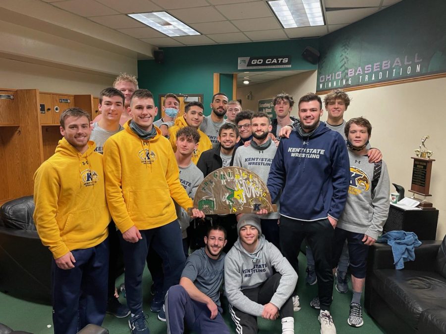 Wrestling team group photo posted to the Kent State Wrestling twitter account (@KentStWrestling). The team poses with the "Grudge Match" rivalry trophy that Kent State and Ohio University compete over after Kent won 22-10 in Athens. Feb. 7, 2021.