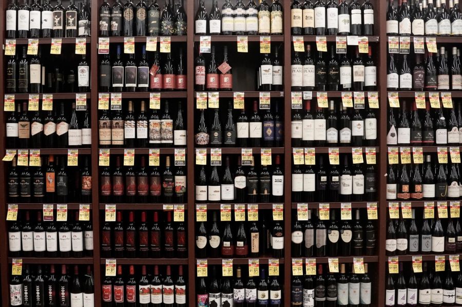 Bottles of red wine are displayed for sale inside Albertsons Cos. grocery store in San Diego, California, U.S. on Monday, June 22, 2020. Existing shareholders of Albertsons Cos., including Cerberus Capital Management, are seeking as much as $1.3 billion in its U.S. initial public offering, as grocery remains of the the few businesses to get a boost from the pandemic. 