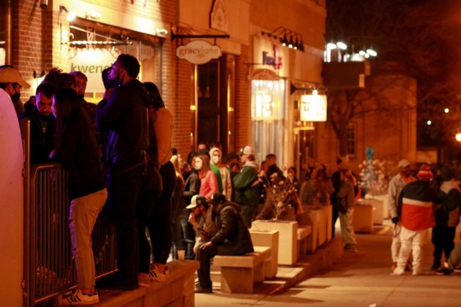 Crowds of people wait to enter Barflyy for Fake Paddy's Day on Friday, March 13.