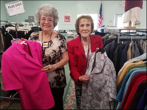 Volunteers organizing clothing at the Community Clothing Center.