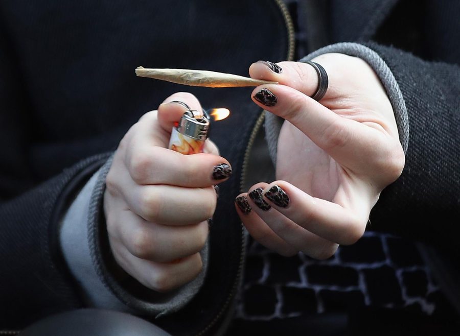 A recreational marijuana smoker indulges in smoking weed on April 14, 2020 in the Bushwick section of the Brooklyn borough of New York City. 