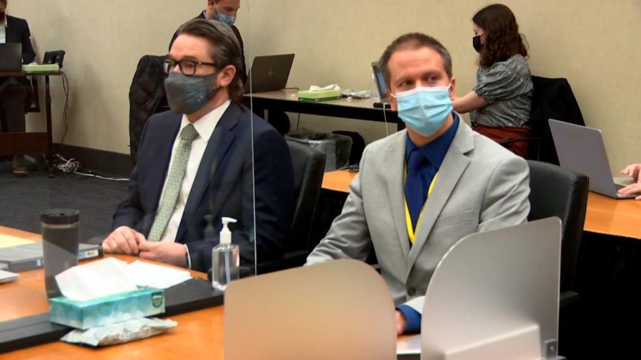 Defense attorney Eric Nelson (left) is seen with Chauvin during trial proceedings.