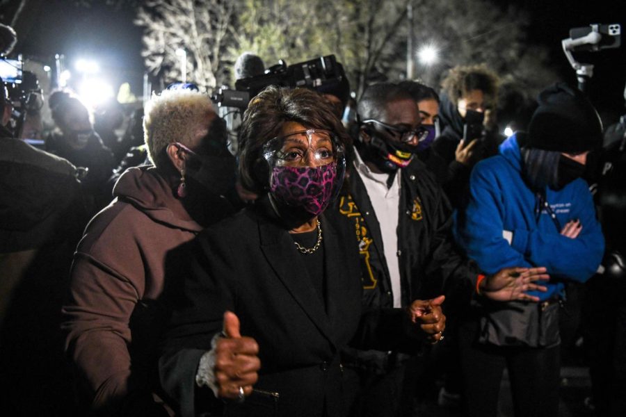 Representative Maxine Waters(C) (D-CA) speaks to the media during an ongoing protest at the Brooklyn Center Police Department in Brooklyn Centre, Minnesota on April 17, 2021. - Police officer, Kim Potter, who shot dead Black 20-year-old Daunte Wright in a Minneapolis suburb after appearing to mistake her gun for her Taser was arrested April 14 on manslaughter charges.