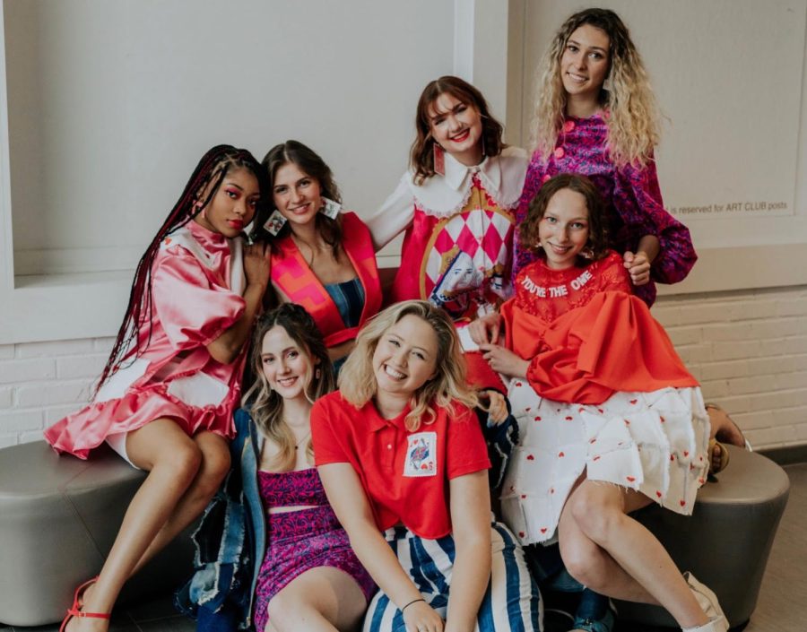 Grace McLain (middle in red shirt) won Best in Show at Kent State’s 2021 Annual Fashion Show for her “All In” collection. Photo courtesy of Grace McLain