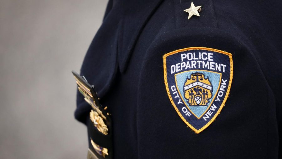 HAMPTON BAYS, NY - FEBRUARY 20: An NYPD officer arrives for the funeral service of fallen NYPD Detective Brian Simonsen at the Church of St. Rosalie, February 20, 2019 in Hampton Bays, New York. Thousands of area police officers and law enforcement personnel attended the funeral. Simonsen was killed by friendly fire while responding with fellow NYPD officers to a robbery at a store in Queens last week. Simonsen is survived by his wife and mother and will be interned at Jamesport Cemetery in nearby Riverhead, New York. (Photo by Drew Angerer/Getty Images)