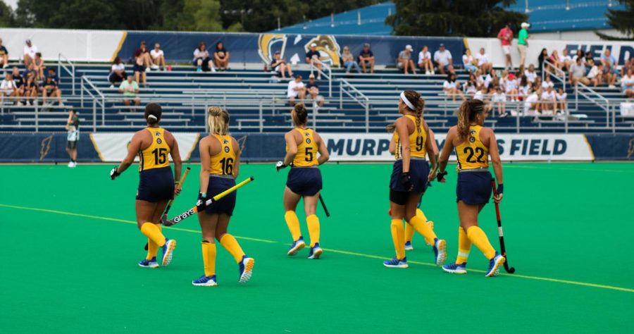 KSU Field Hockey Players walk onto Murphy-Mellis Field during their game against OSU on Tuesday, Aug. 31.