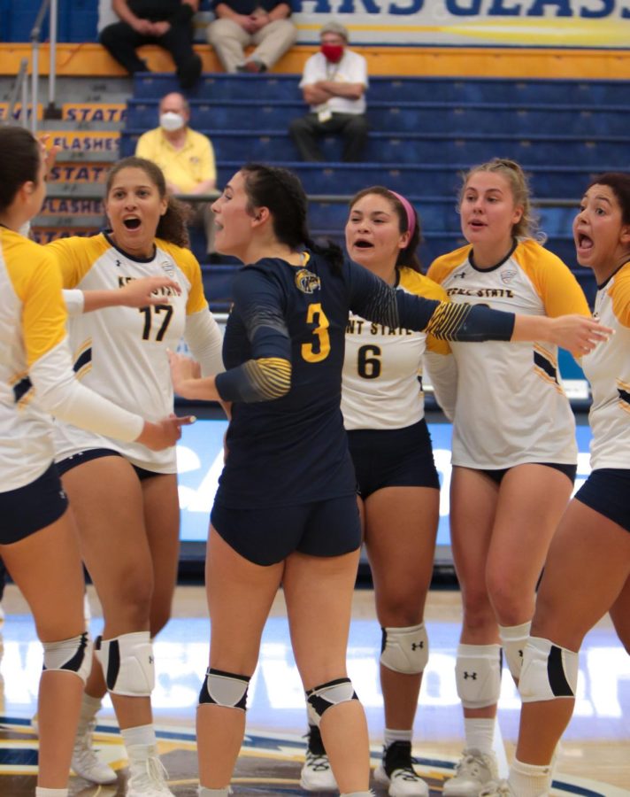 The Kent State women's volleyball team celebrates winning a point during the volleyball match against Youngstown University on Sept. 16, 2021. The Flash's beat Youngstown 3-1.