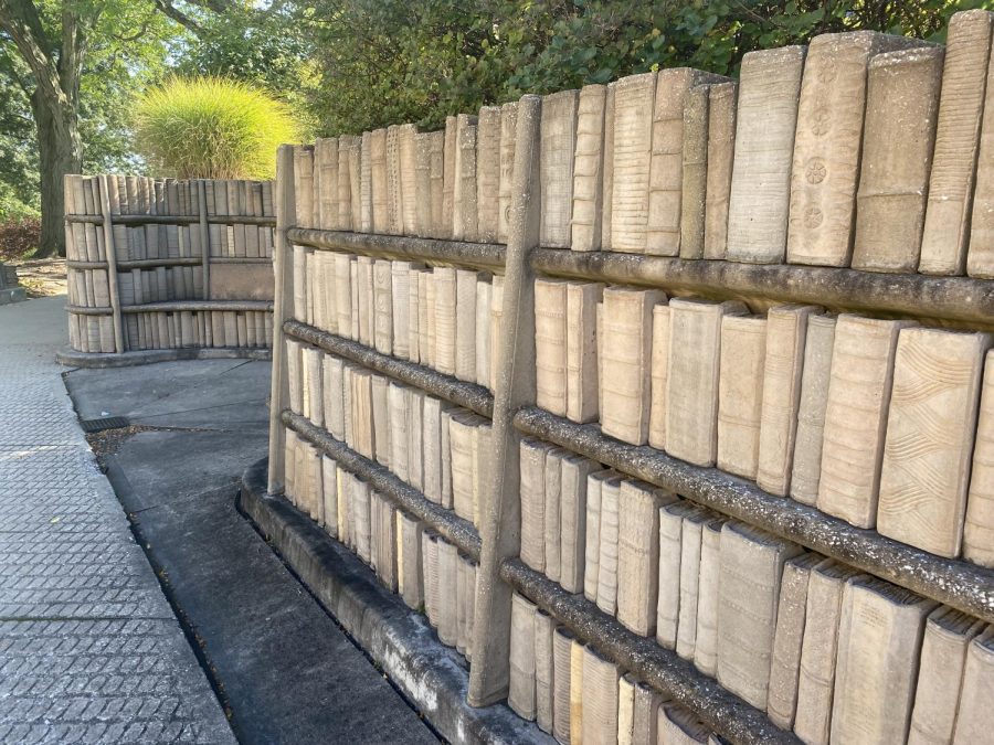 Sculpted concrete bookcases in the Beck Family Gardens on the east side of Merrill Hall. 