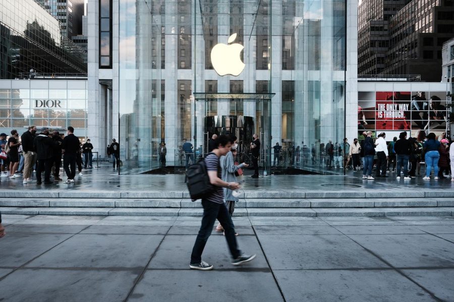 NEW YORK, NEW YORK - SEPTEMBER 24: People shop at the Fifth Avenue Apple Store during the launch of Apple’s new iPhone 13 and iPhone 13 Mini on September 24, 2021 in New York City. The new phones come equipped with a A15 Bionic chip, improved dual-camera system and longer battery life than the iPhone 12. The iPhone 13 Mini starts at $729, and the iPhone 13 starts at $829. (Photo by Spencer Platt/Getty Images)