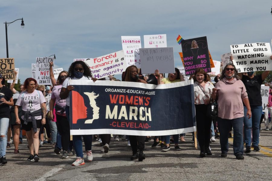 Participants in Cleveland's Women's March cross over the Hope Memorial Bridge on Saturday, Oct. 2, 2021.