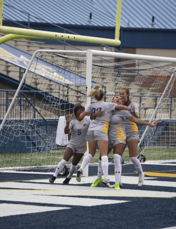 Members of the Kent State Women's soccer team celebrate getting a goal during the soccer game against Bowling Green State University on Oct. 3, 2021. Kent State lost 3-2.