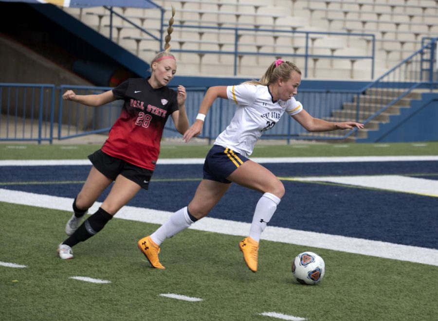 Redshirt senior Karly Hellstrom (23) dribbles the ball toward the goal during the soccer game against Ball State University on Oct. 17, 2021.