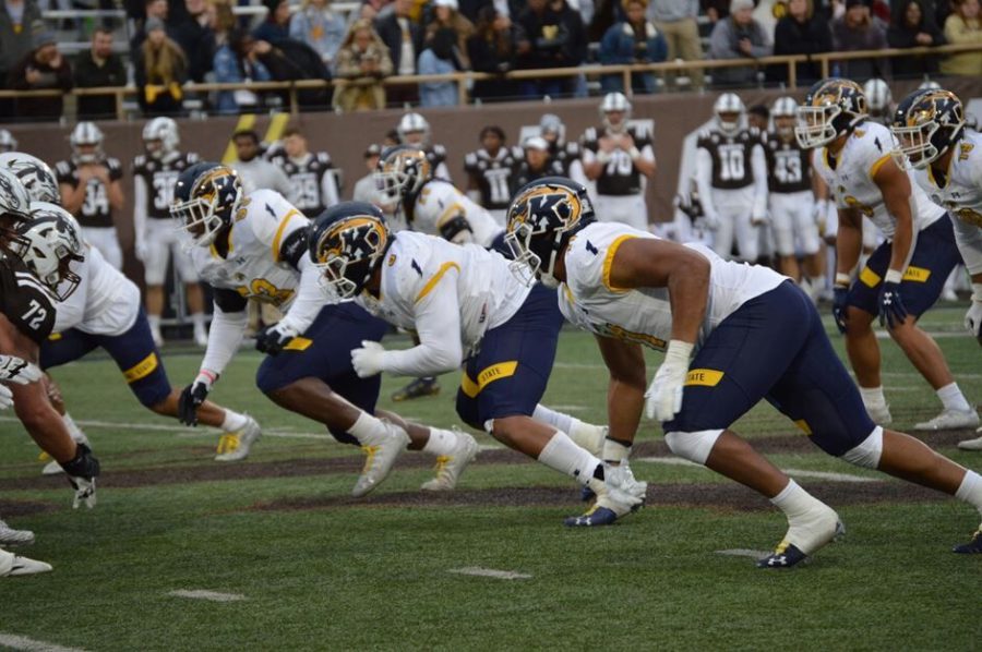 The Kent State football team's defense prepares to run a play against Western Michigan University in Kalamazoo, Michigan on Saturday Oct. 16. 