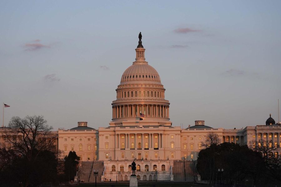 The sun sets on the U.S. Capitol building, Thursday, March 4, 2021, in Washington. 