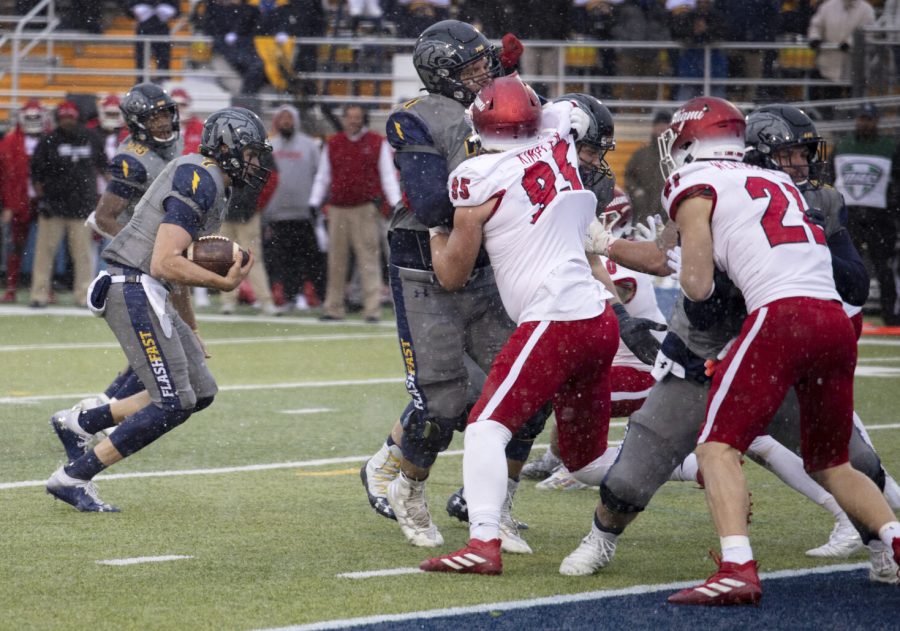 Quarterback Dustin Crum (7) runs the ball into the end zone during the football game against Miami University on Nov. 27, 2021. Kent State beat Miami University 48-47 in overtime.