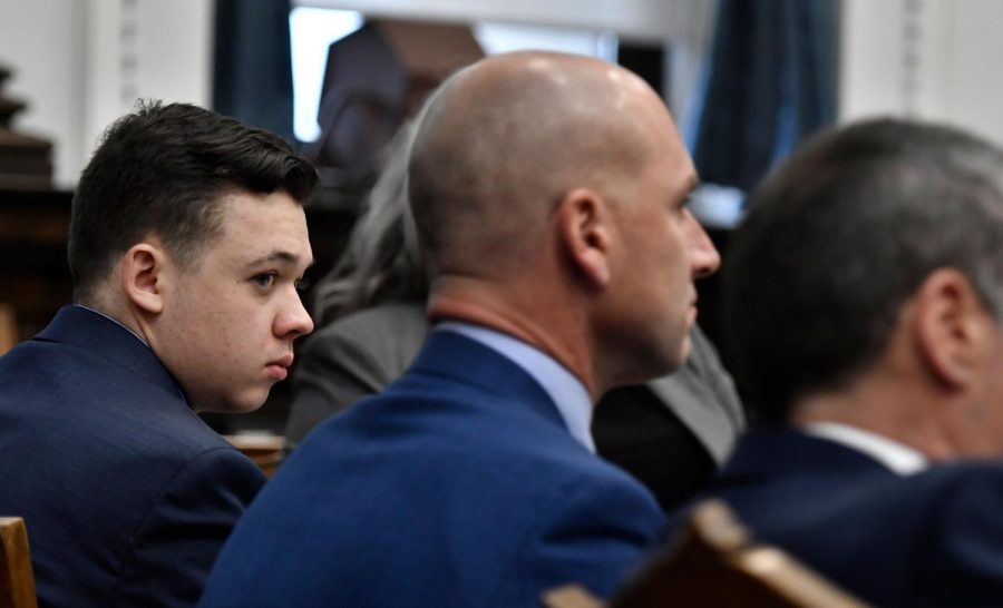 Kyle Rittenhouse listens as the attorneys and the judge talk about jury instructions at the Kenosha County Courthouse in Kenosha, Wis., on Monday, Nov. 15, 2021. Rittenhouse is accused of killing two people and wounding a third during a protest over police brutality in Kenosha, last year. (Sean Krajacic/The Kenosha News via AP, Pool)