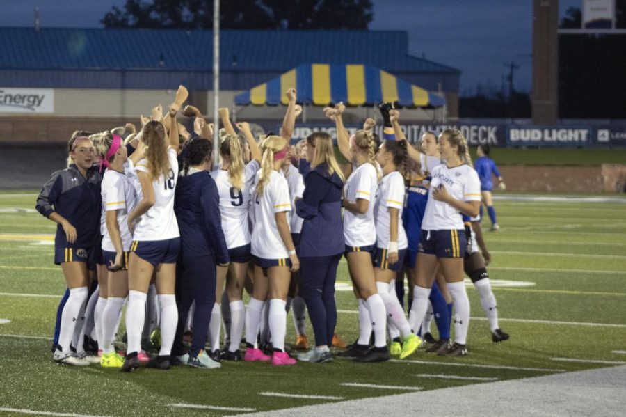 The Kent State Women's Soccer team joins in a hype chant before the game against Northern Illinois University on Oct. 7. Kent State Flashes won 2-0.