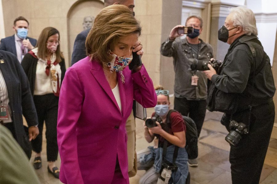 U.S. House Speaker Nancy Pelosi, a Democrat from California, arrives to the U.S. Capitol in Washington, D.C., U.S., on Friday, Nov. 5, 2021. The House plans to vote today on the White House's $1.75 trillion economic package and a separate infrastructure bill, after intense 11th-hour negotiations by the House Speaker appeared to settle lingering differences. Photographer: Craig Hudson/Bloomberg via Getty Images