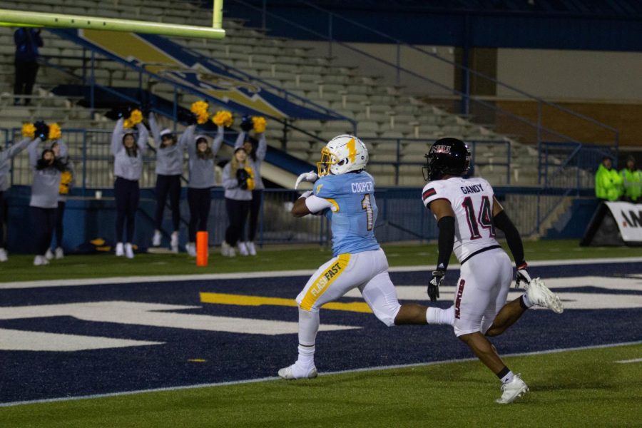 Marquez Cooper rushes in for a fourth quarter touchdown during Kent State's 52-47 win over Northern Illinois on Wednesday night. 