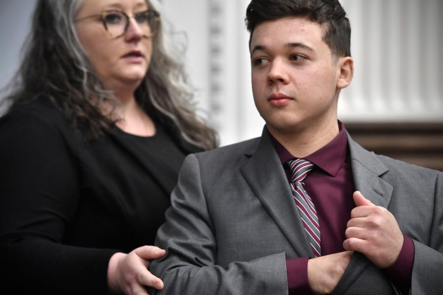 Kyle Rittenhouse, right, puts a pen in his pocket and looks to the gallery as his attorney Natalie Wisco moves him toward the door during a break in the trial at the Kenosha County Courthouse in Kenosha, Wis., on Thursday, Nov. 4, 2021. Rittenhouse is accused of killing two people and wounding a third during a protest over police brutality in Kenosha, last year. (Sean Krajacic/The Kenosha News via AP, Pool)