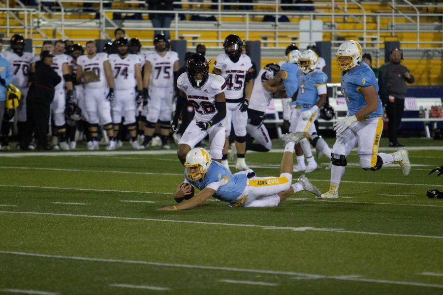 Quarterback Dustin Crum dives forward to end a first down run during Kent State's 52-47 win over Northern Illinois on Wednesday night. 